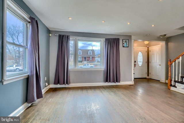 entrance foyer with hardwood / wood-style floors