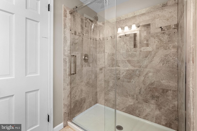 bathroom featuring an enclosed shower