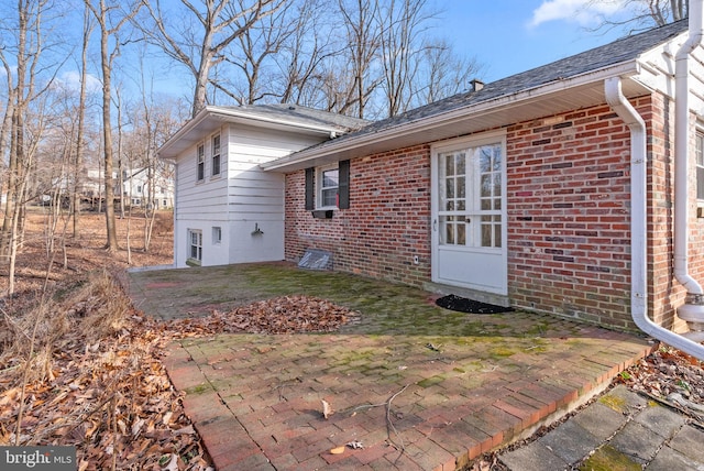 view of side of home with a patio area