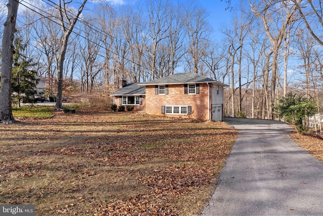 view of property exterior with a garage