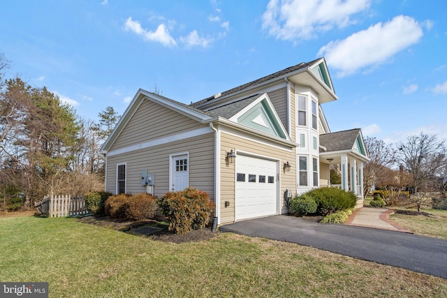 view of side of property with a yard