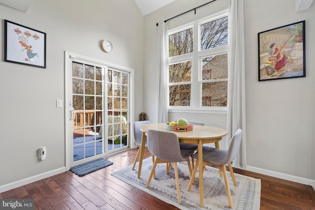 dining space featuring dark hardwood / wood-style flooring