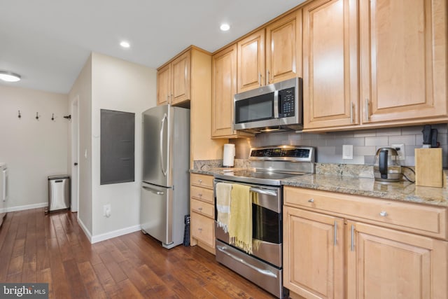 kitchen featuring light stone counters, light brown cabinets, appliances with stainless steel finishes, dark hardwood / wood-style flooring, and decorative backsplash