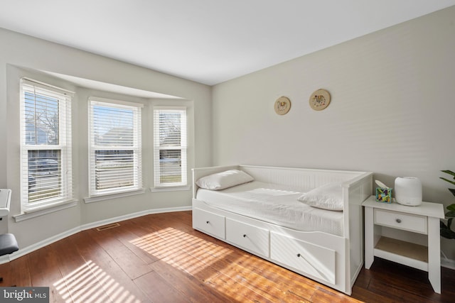 bedroom featuring dark hardwood / wood-style floors