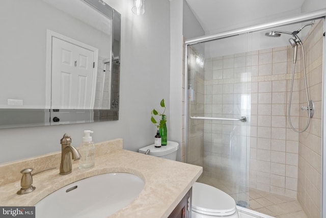 bathroom with vanity, toilet, and walk in shower