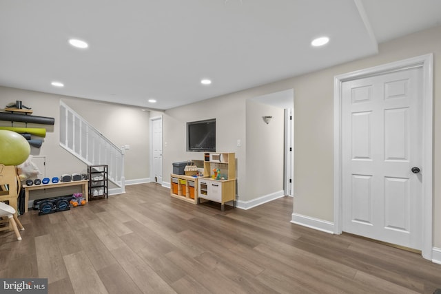 recreation room with hardwood / wood-style floors