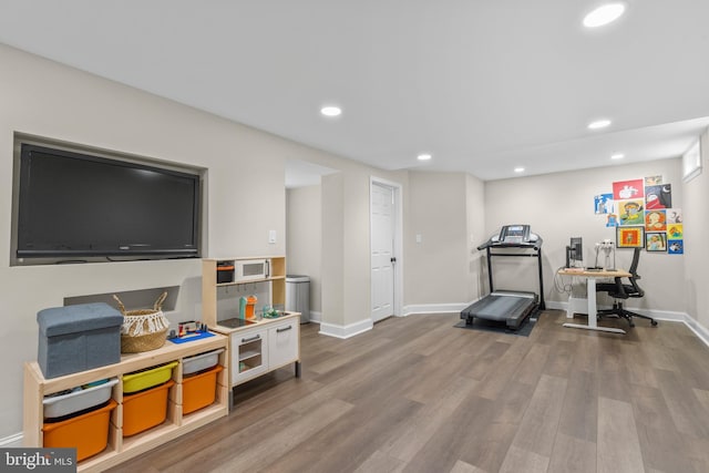 workout room with hardwood / wood-style flooring