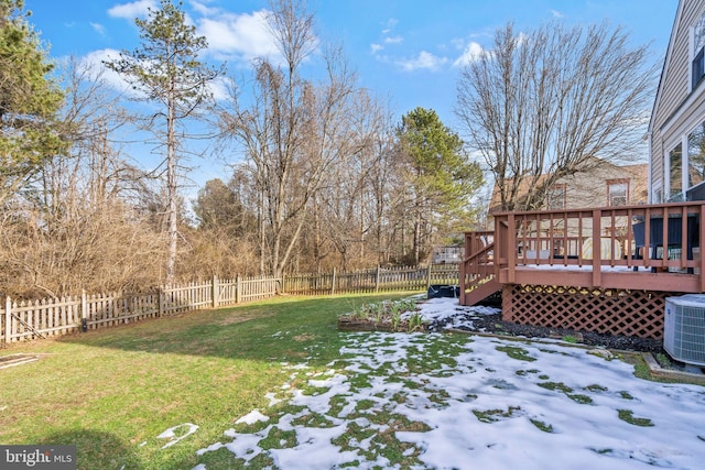 view of yard with a wooden deck and central AC