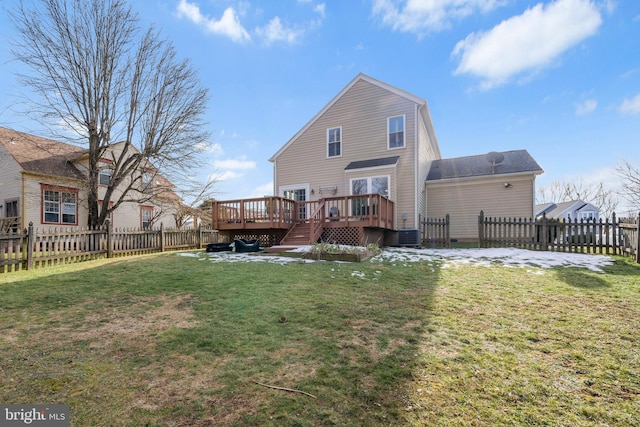 back of house featuring a yard, central AC, and a deck