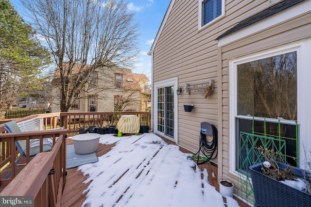 view of snow covered deck