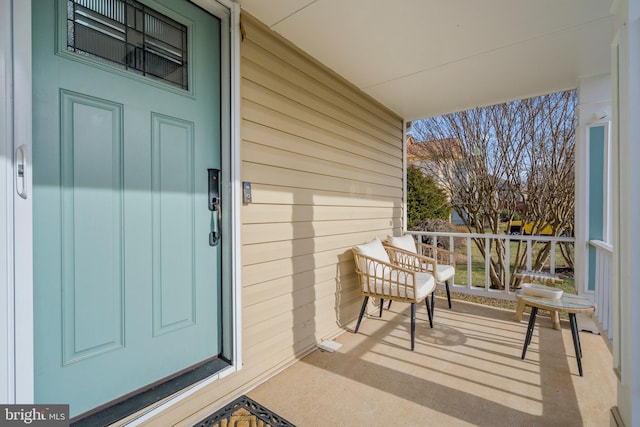 view of exterior entry with covered porch