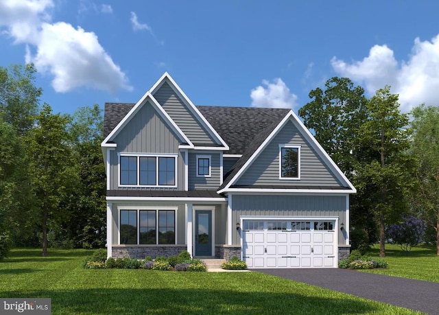 craftsman house featuring a garage and a front yard