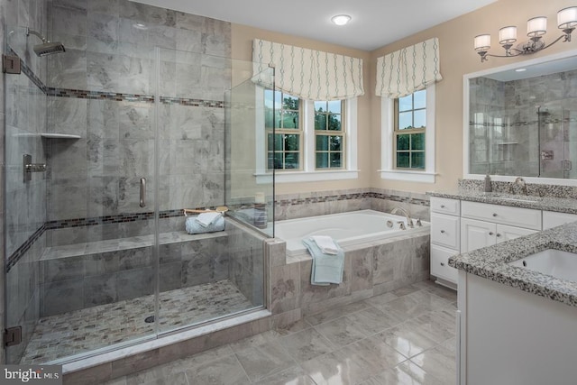 bathroom featuring independent shower and bath and vanity