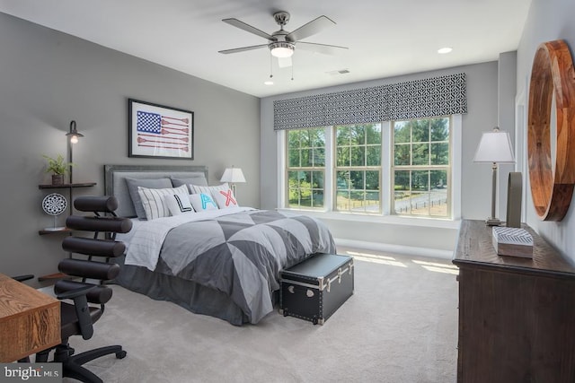 carpeted bedroom with ceiling fan