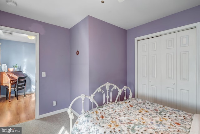 carpeted bedroom with a closet