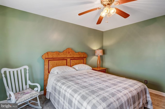 bedroom featuring hardwood / wood-style flooring and ceiling fan