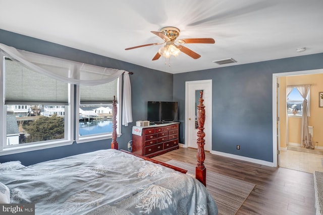 bedroom featuring hardwood / wood-style flooring and ceiling fan