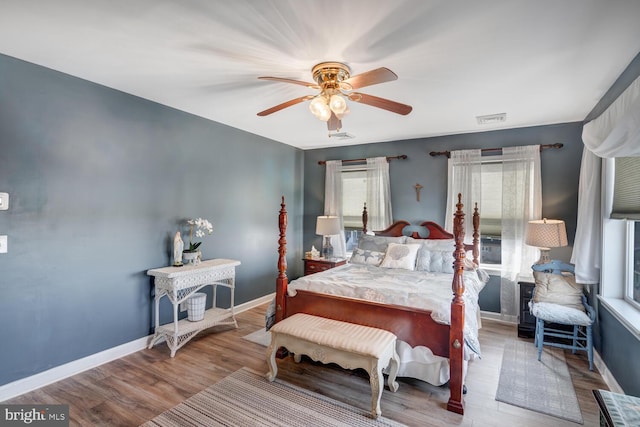 bedroom featuring hardwood / wood-style floors and ceiling fan