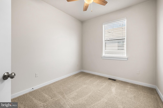 unfurnished room featuring carpet and ceiling fan