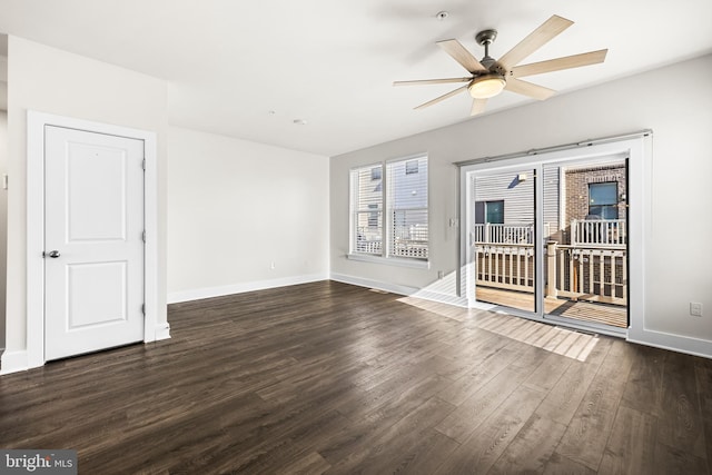 unfurnished room featuring dark wood-type flooring and ceiling fan