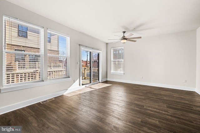 unfurnished room featuring dark hardwood / wood-style flooring and ceiling fan