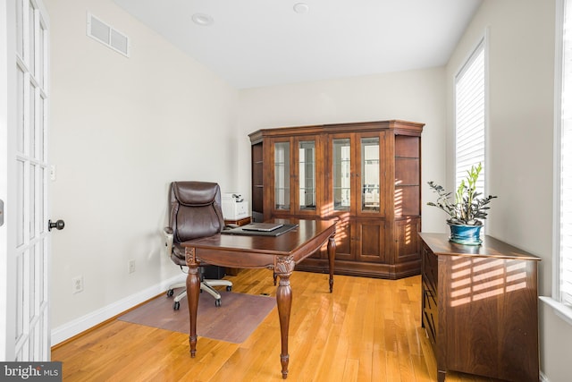 home office with light wood-type flooring