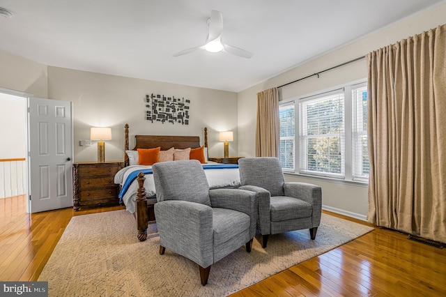 bedroom with ceiling fan and light hardwood / wood-style flooring