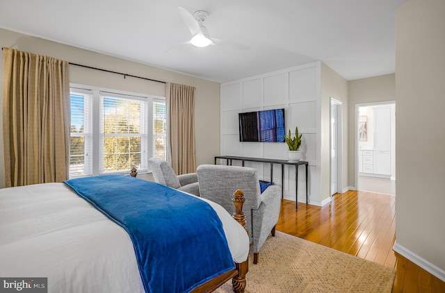 bedroom with wood-type flooring and ceiling fan