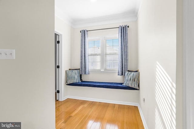 hallway with crown molding and wood-type flooring