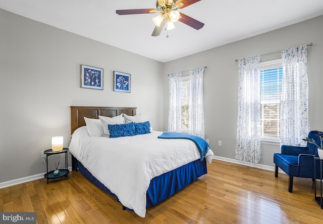 bedroom featuring ceiling fan and hardwood / wood-style floors