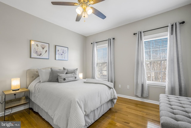 bedroom featuring hardwood / wood-style floors and ceiling fan