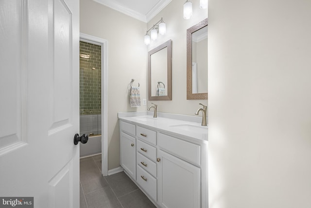 bathroom featuring tile patterned flooring, vanity, and crown molding