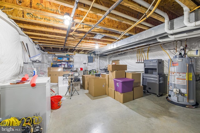 basement featuring washer and dryer and water heater