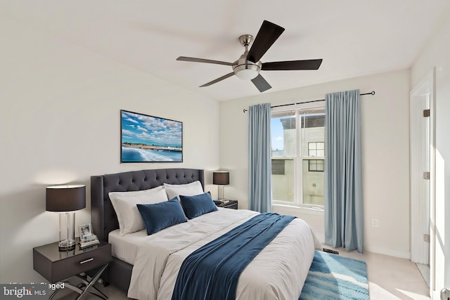 bedroom featuring light carpet and ceiling fan