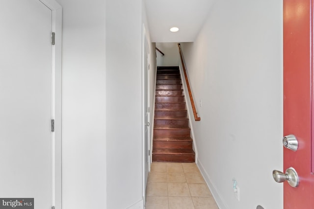 staircase with tile patterned floors