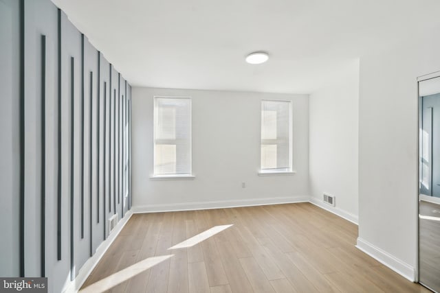 unfurnished room featuring light hardwood / wood-style flooring