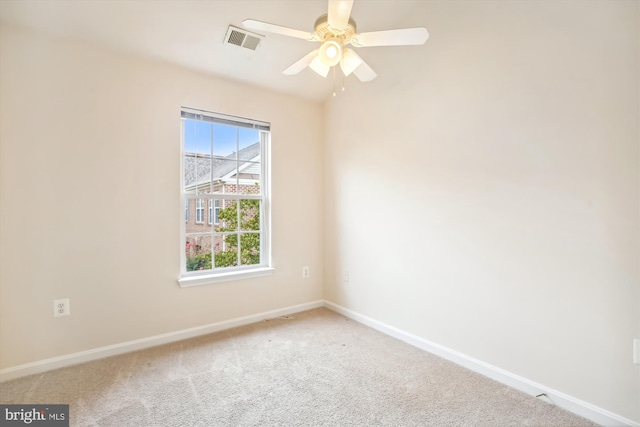 empty room with carpet floors and ceiling fan