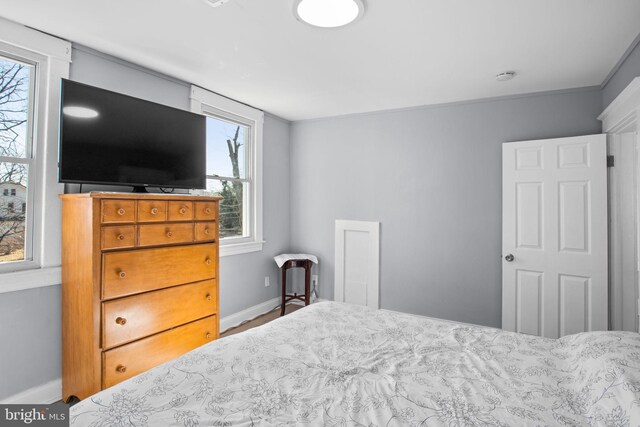 bedroom featuring baseboards