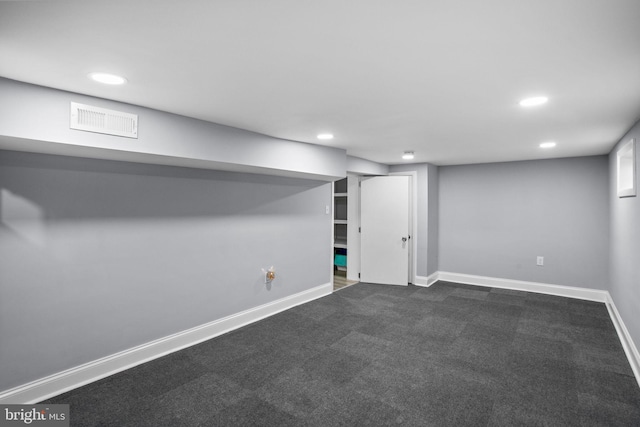 finished basement with visible vents, recessed lighting, baseboards, and dark colored carpet