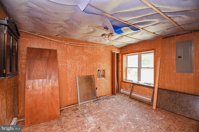 spare room with a baseboard heating unit and electric panel