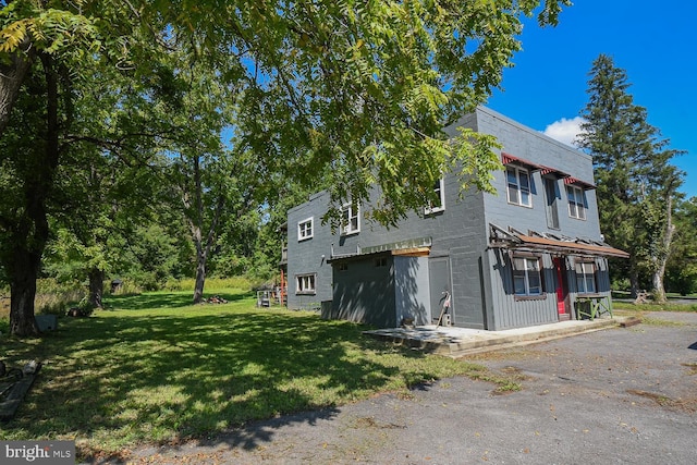 view of property exterior featuring a yard