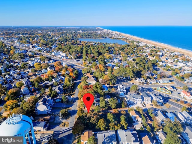 aerial view with a water view and a view of the beach