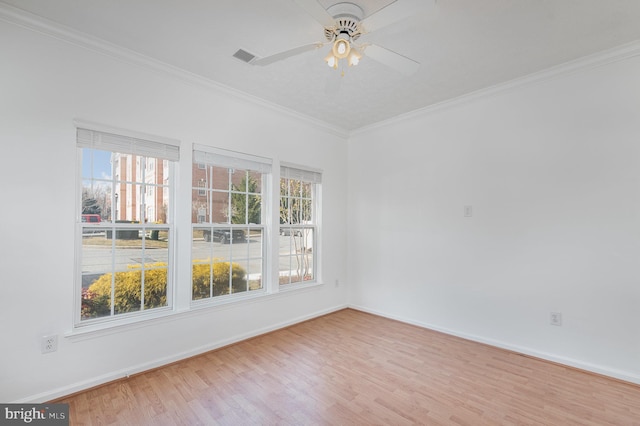 unfurnished room with crown molding, light hardwood / wood-style flooring, and ceiling fan