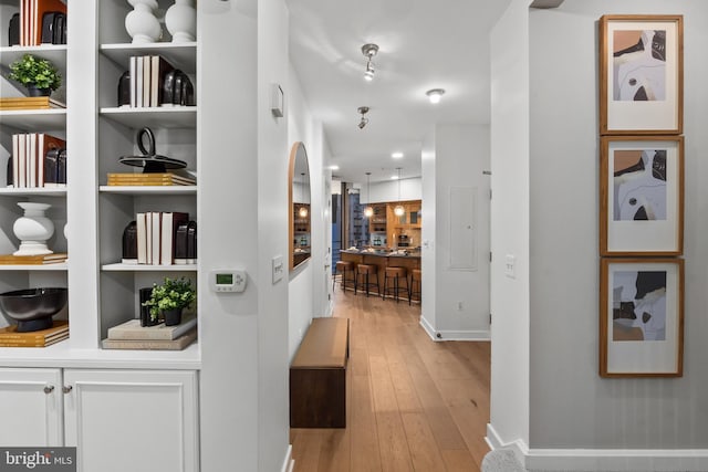 corridor featuring light hardwood / wood-style floors