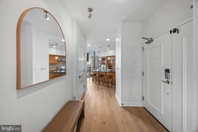 hallway featuring light hardwood / wood-style flooring