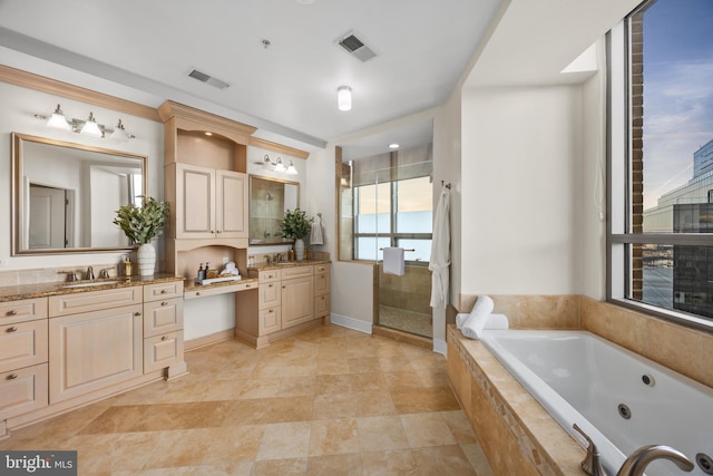 bathroom featuring vanity and separate shower and tub