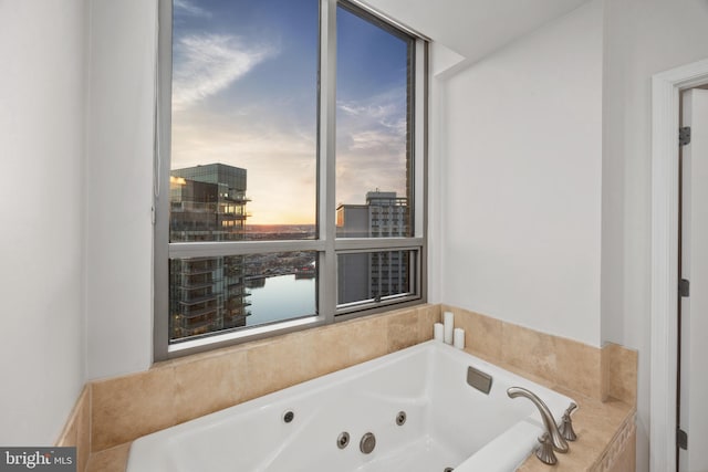 bathroom featuring a relaxing tiled tub