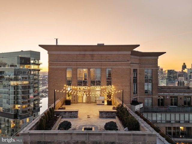 view of outdoor building at dusk