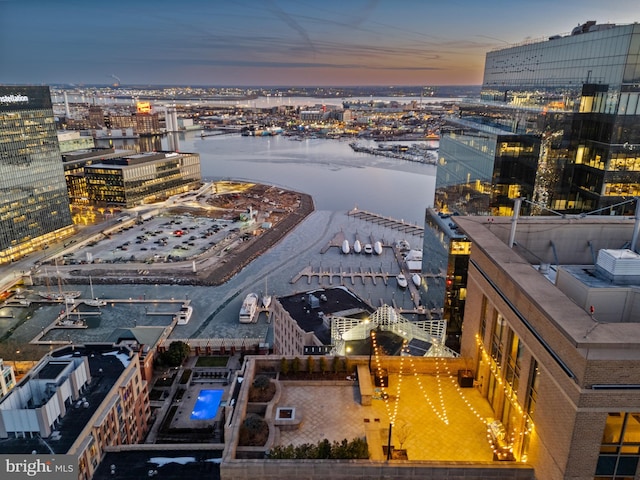 aerial view at dusk with a water view