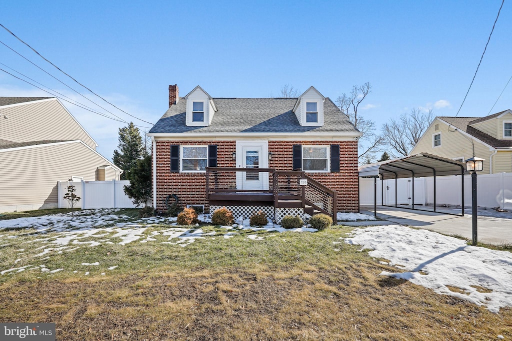 view of front of house featuring a carport, a wooden deck, and a front yard